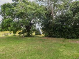 A tent surrounded by trees and grass at 1 Bed Sleeps 2, Shared Bathroom in Monewden near Otley, Suffolk