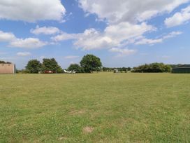An outdoor area with airplanes and a hangar at 1 Bed Sleeps 2, Shared Bathroom, Monewden near Otley, Suffolk