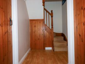 A staircase leading to upper levels at The Stables in Falmouth