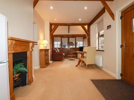 A living room with a sofa and table at Farrier Cottage in Falmouth