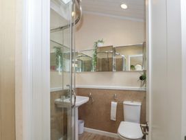 A bathroom with shower, sink, and toilet at Labernum in Lytham St. Annes