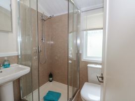 A bathroom with a shower and toilet at Labernum in Lytham St. Annes