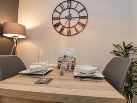 A dining room setup with a table and chairs at Rosie's Retreat, Filey