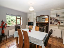 A dining room with a table and chairs at Lilly's Bungalow in Clonakilty, County Cork