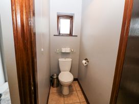 A bathroom with a toilet and sink at Lilly's Bungalow, Clonakilty, County Cork