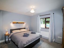 A bedroom with a bed and bedside table at Lilly's Bungalow Clonakilty, County Cork