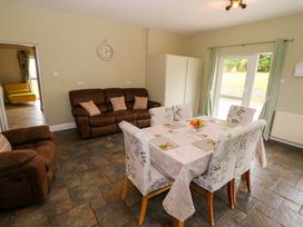 A dining room with a table and chairs at CARROWREAGH