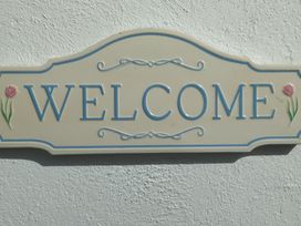 A welcome sign on a wall at Carrowreagh, Aclare, County Sligo