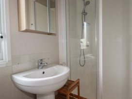 A bathroom with a sink and shower at The Maples, no. 56 Hewas Water near Polgooth