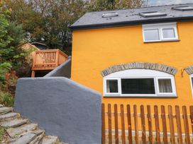 A house with windows and decking at Pendre Barn Star near Cenarth