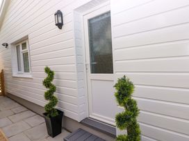 An entrance with a door and windows at Pinecroft Annex Stepaside near Saundersfoot