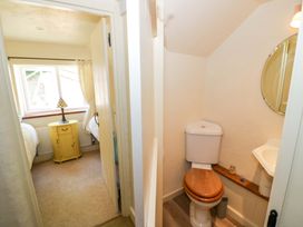 A bathroom with a toilet and sink at Fern Cottage