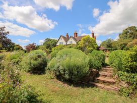 A house with a garden and stone steps at Uplands House in Ledbury