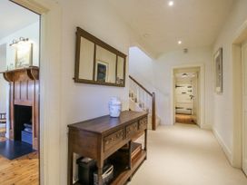 A hallway with a console table and mirror at Uplands Dowerhouse Wellington Heath near Ledbury