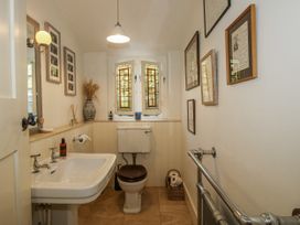 A bathroom with a sink and toilet at Uplands Dowerhouse in Wellington Heath near Ledbury