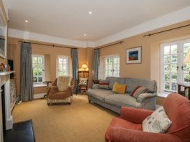 A living room with a sofa and armchair at Uplands Dowerhouse Wellington Heath near Ledbury
