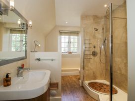 A bathroom with a shower and sink at Uplands Dowerhouse in Wellington Heath near Ledbury
