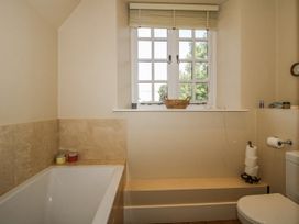 A bathroom with a bathtub and toilet at Uplands Dowerhouse in Wellington Heath near Ledbury