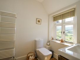 A bathroom with a toilet and sink at Uplands Dowerhouse in Wellington Heath near Ledbury