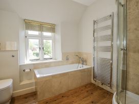A bathroom with a bathtub and a shower at Uplands Dowerhouse Wellington Heath near Ledbury