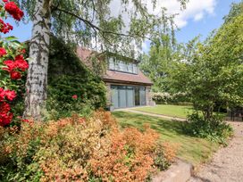 A house with large windows and garden at Uplands Cottage in Ledbury