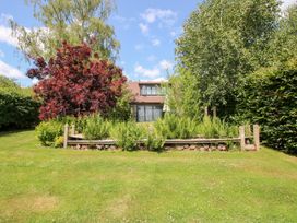 A house with a garden and trees at Uplands Cottage in Ledbury