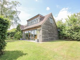 A house with windows and garden at Garden Cottage in Wellington Heath near Ledbury