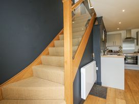 A staircase leading to a kitchen at Garden Cottage in Wellington Heath near Ledbury