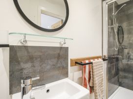 A bathroom with sink and shower at Garden Cottage Wellington Heath near Ledbury