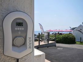 An EV charger with a view of outdoor seating at Evelyn in Looe