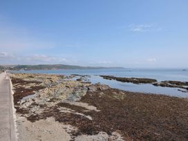 A coastal scene with rocks and seaweed at Evelyn in Looe