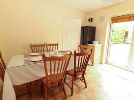 A dining room with a table and chairs at 51 Woodview Park in Tralee, County Kerry
