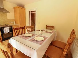 A dining room with a table and chairs at 51 Woodview Park Tralee County Kerry