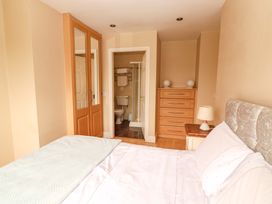 A bedroom with a bed and attached bathroom at 51 Woodview Park, Tralee, County Kerry