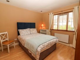A bedroom with a bed and a window at 51 Woodview Park Tralee, County Kerry