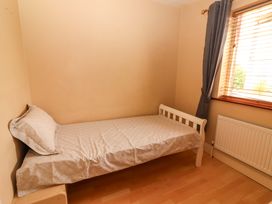 A bedroom with a single bed and a window at 51 Woodview Park, Tralee, County Kerry