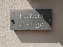 A nameplate for Farriers Cottage