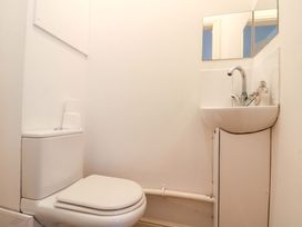 A bathroom with a toilet and sink at Chestnut Cottage in Bridlington