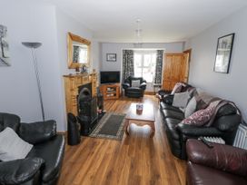 A living room with a TV and fireplace at 22 White Maples in Bundoran, County Donegal