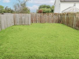 A garden with grass and a fence at 22 White Maples, Bundoran, County Donegal
