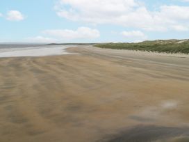 A beach with sand and water at 22 White Maples Bundoran, County Donegal