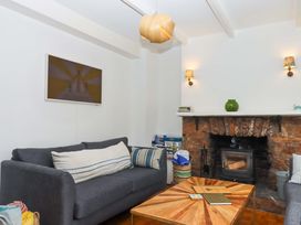 A living room featuring a sofa and coffee table at Captains Cottage in Brixham