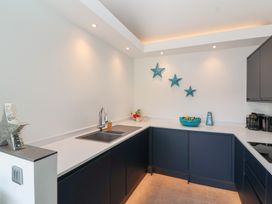 A kitchen with a sink and cabinets at Noflash Malpal in Bristol