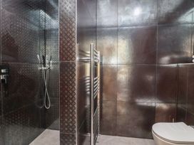 A bathroom with a shower and a toilet at Noflash Malpal in Bristol