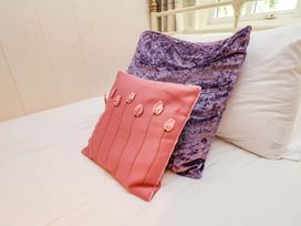 Two pillows on a bed at 5 Hollins Cottages in Whitby