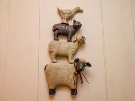 Decorative animal figures on a wall at 5 Hollins Cottages Whitby