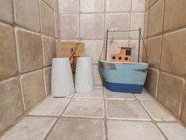 Decorative items including vases and a boat on tiles