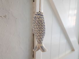 A fish decoration hanging on a wall at Buttercup in Blakeney, Norfolk