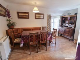 A dining room with a table and chairs at The Plover in Blakeney, Norfolk