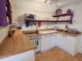 A kitchen with cabinets and appliances at The Plover in Blakeney, Norfolk